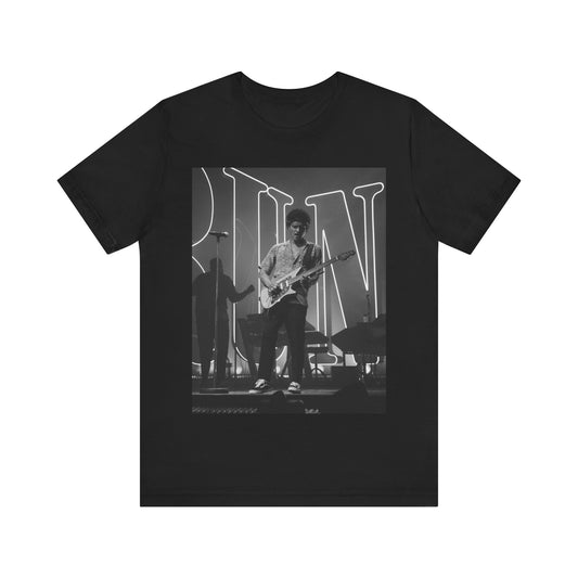 A black graphic t-shirt featuring a black and white photo of Bruno Mars performing live on stage.