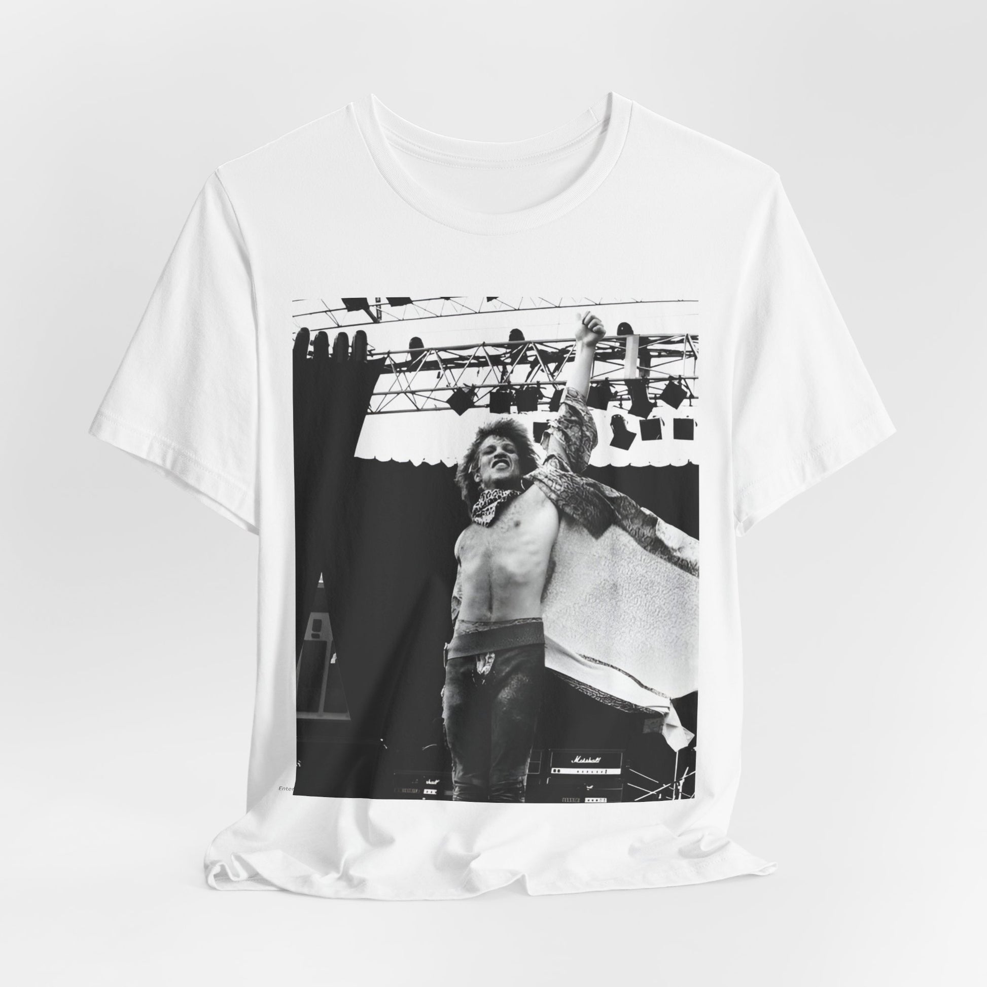 A black graphic t-shirt featuring an epic arena rock graphic of Bon Jovi performing on a large stage.