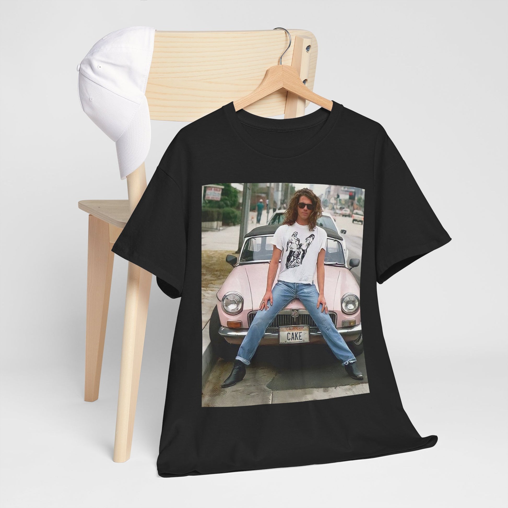 A black graphic t-shirt featuring a vintage photo of INXS band members with a classic car.