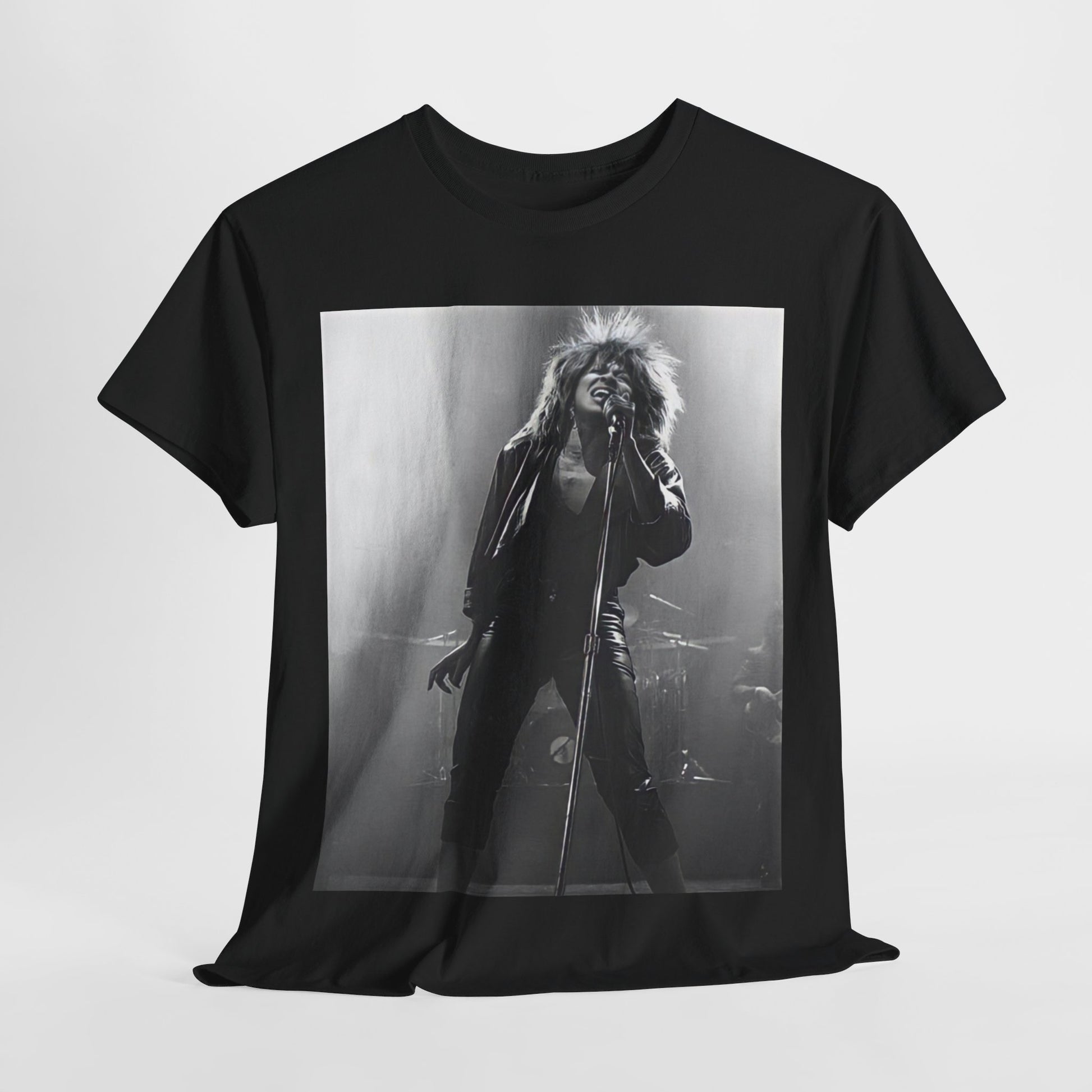 A black graphic t-shirt featuring a graphic of Tina Turner performing "Proud Mary" live.