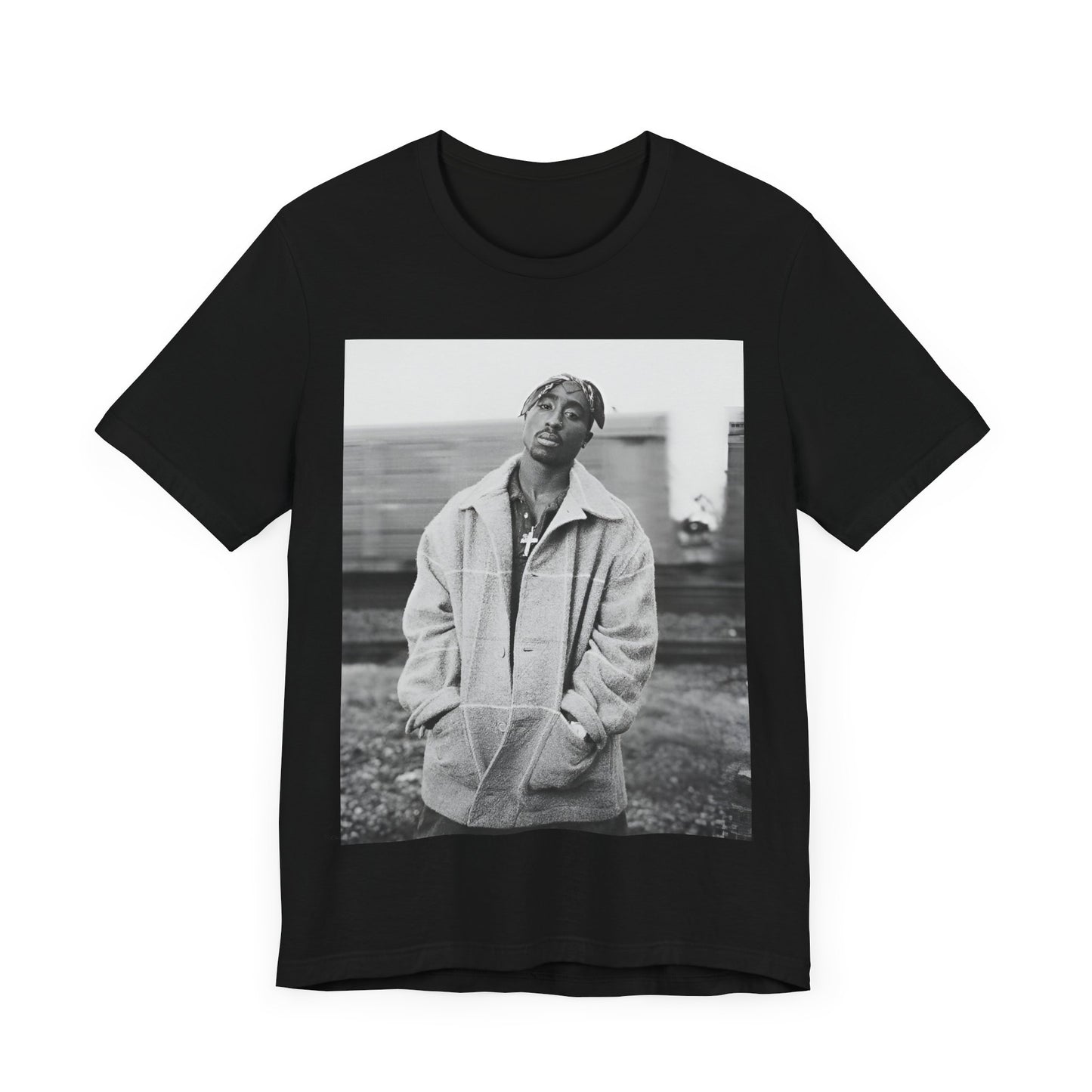A black graphic t-shirt featuring a graphic related to Tupac's 'Thug Life' philosophy.