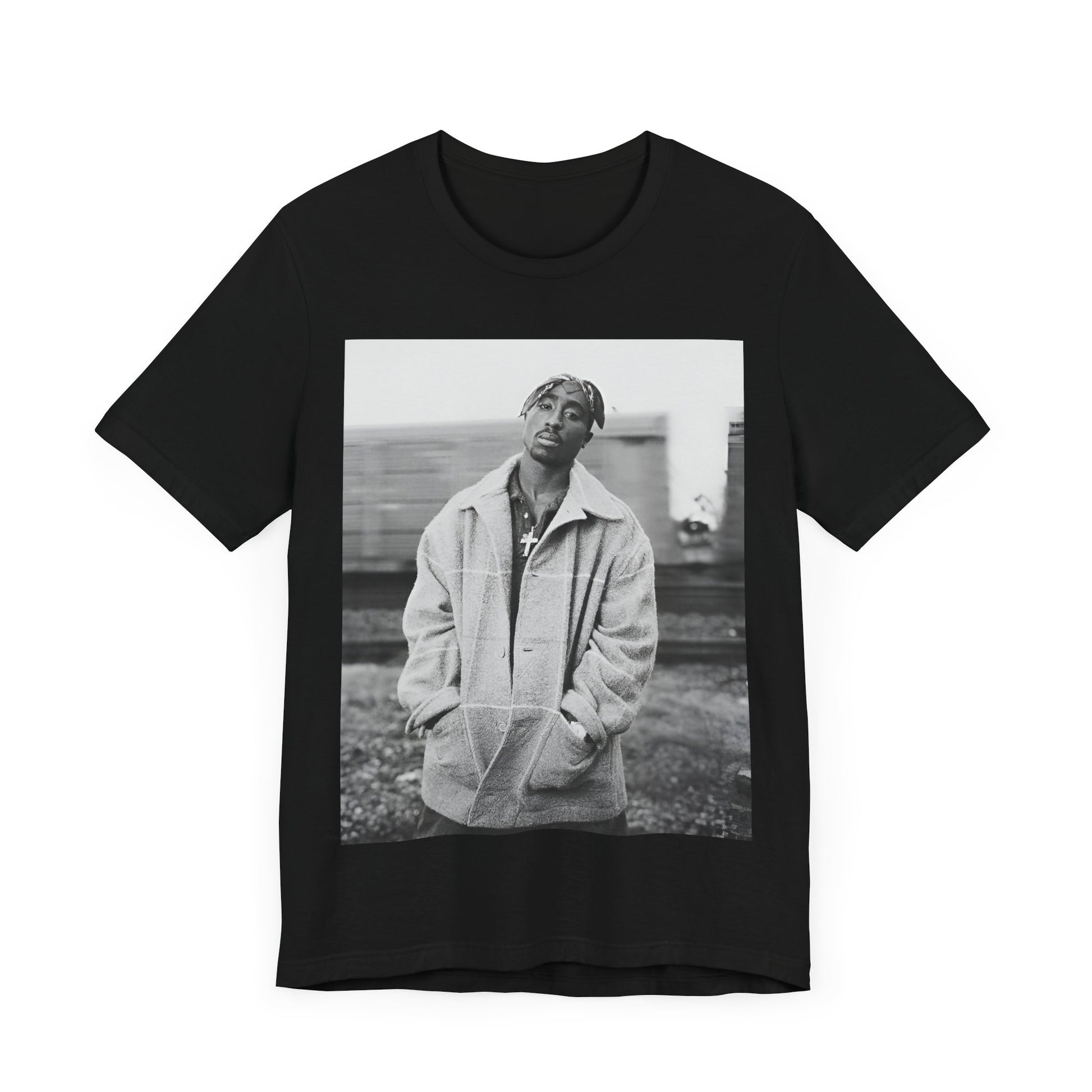 A black graphic t-shirt featuring a graphic related to Tupac's 'Thug Life' philosophy.