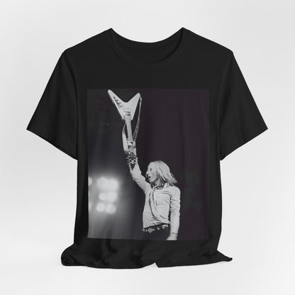 A black graphic t-shirt featuring a graphic or photo of Tom Petty playing guitar on stage.
