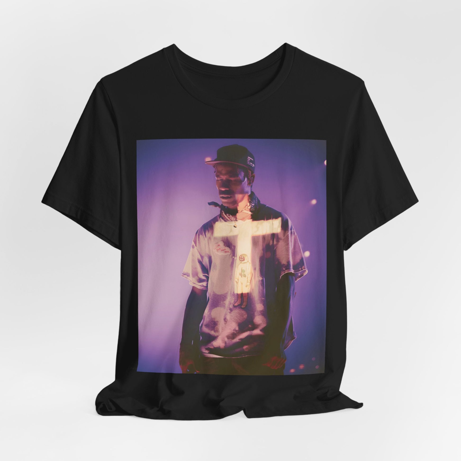 A black graphic t-shirt featuring a graphic of Travis Scott with dark fantasy vibes.