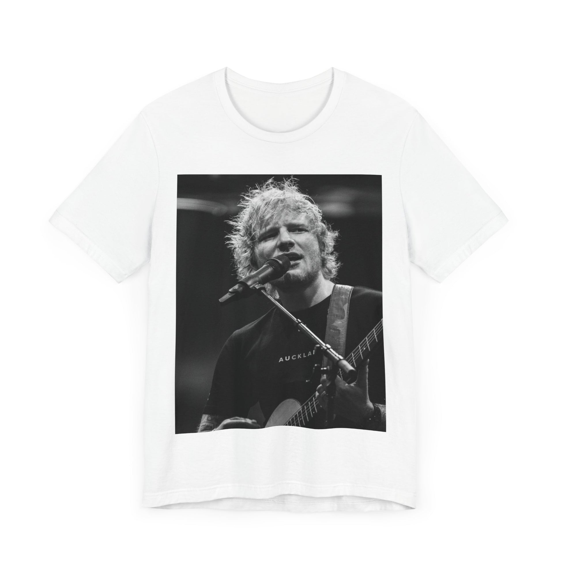 A black graphic t-shirt featuring a black and white photo of Ed Sheeran performing live.