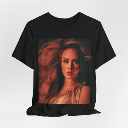 A black graphic t-shirt featuring a glamorous portrait of Adele wearing a golden gown, with voluminous hair, bathed in warm lighting, giving an editorial look.