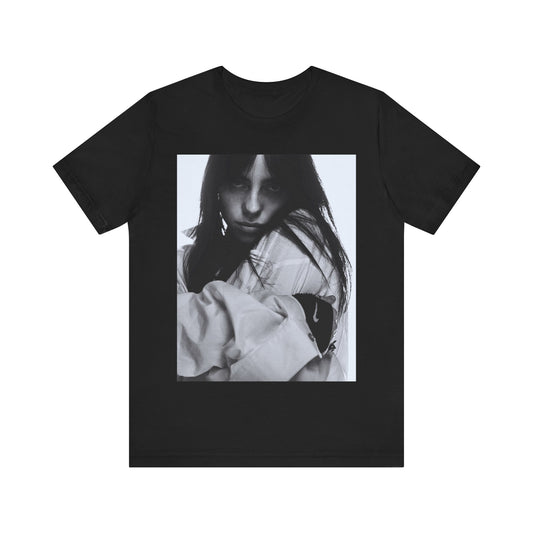 Billie Eilish posing in her signature oversized designer streetwear, printed on a graphic t-shirt.
