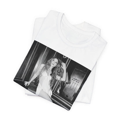A black graphic t-shirt featuring a retro black and white monochrome graphic or photo of Shakira.