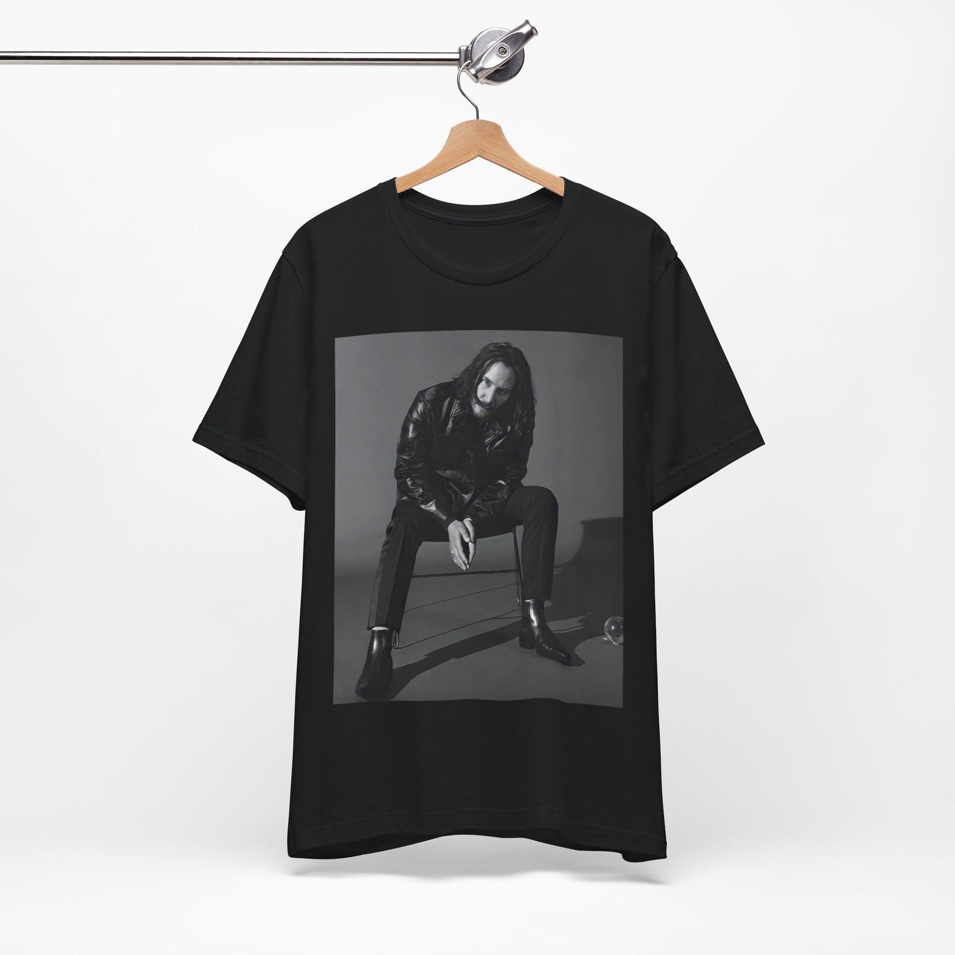 A black graphic t-shirt featuring a graphic of Keanu Reeves as John Wick.