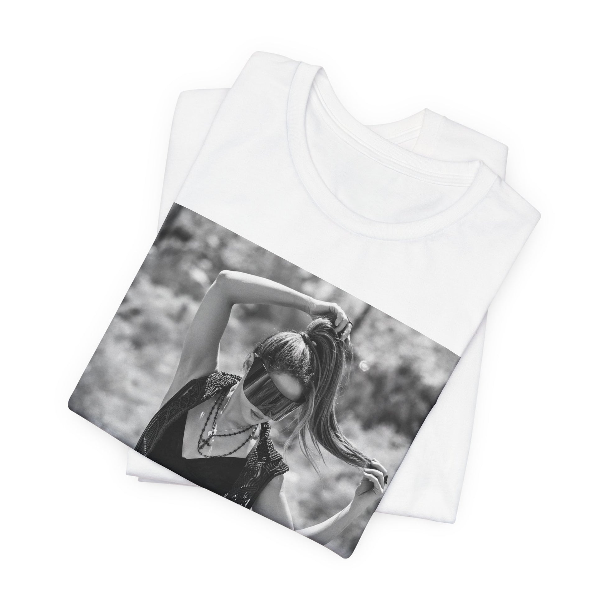 A black graphic t-shirt featuring a black and white, monochrome graphic or photo of Shakira.