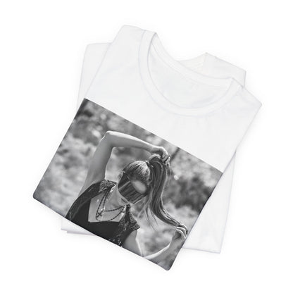 A black graphic t-shirt featuring a black and white, monochrome graphic or photo of Shakira.