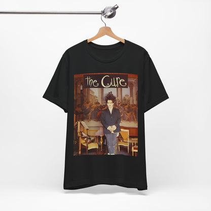 A black graphic t-shirt featuring a graphic of Robert Smith from The Cure as a goth icon.