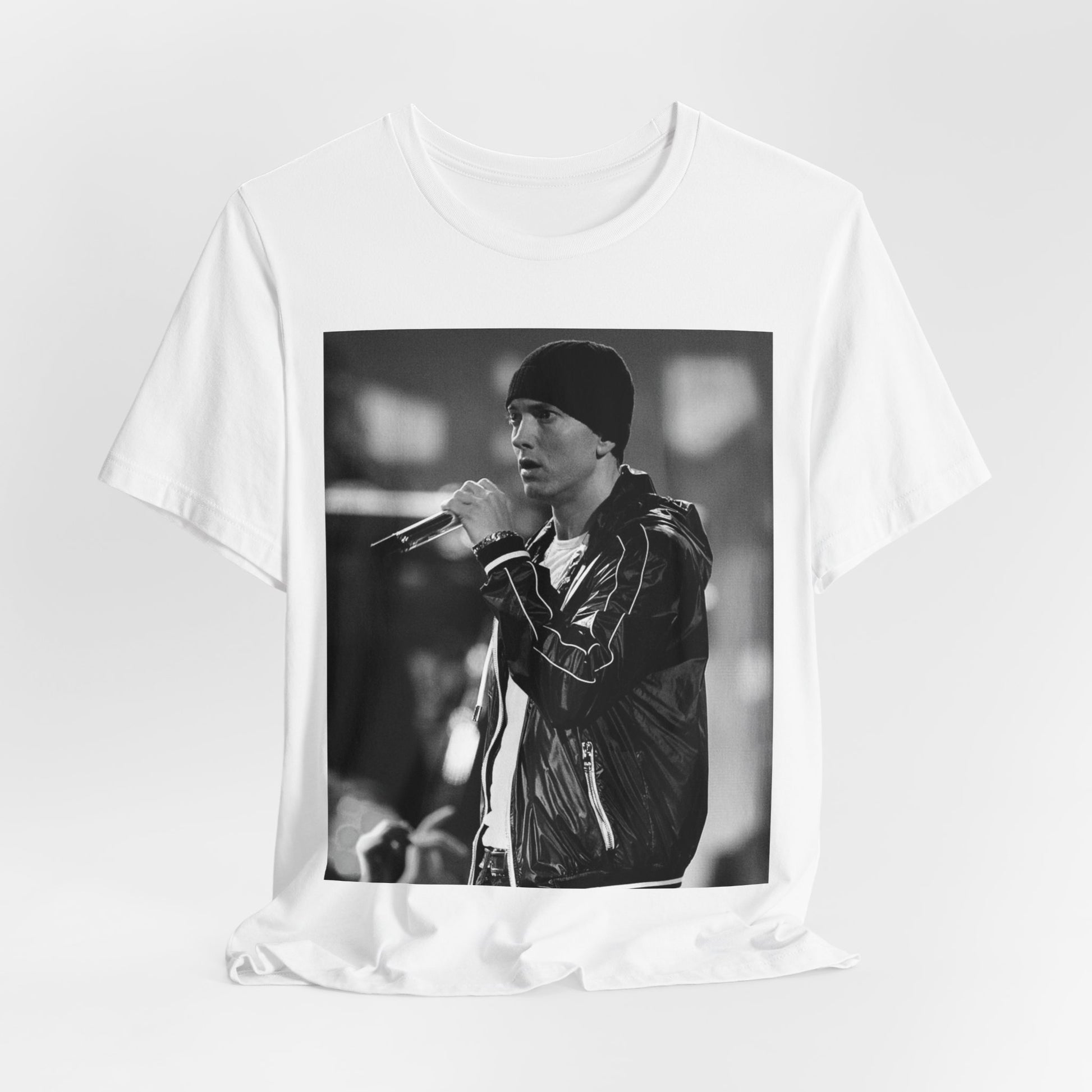 A black graphic t-shirt featuring a classic 90s graphic of Eminem as a 'Rap God'.