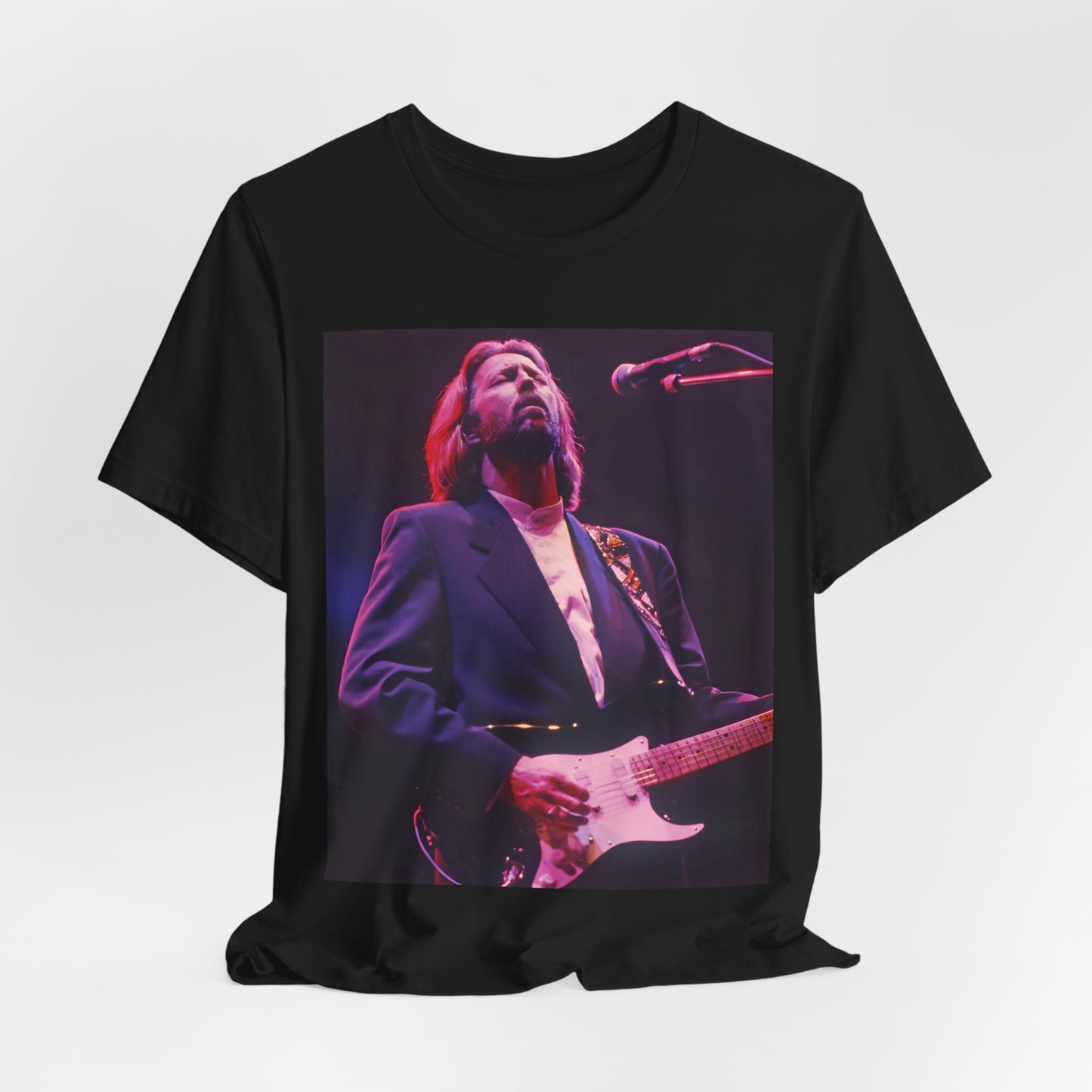 A black graphic t-shirt featuring a vintage graphic of Eric Clapton as a blues rock icon.