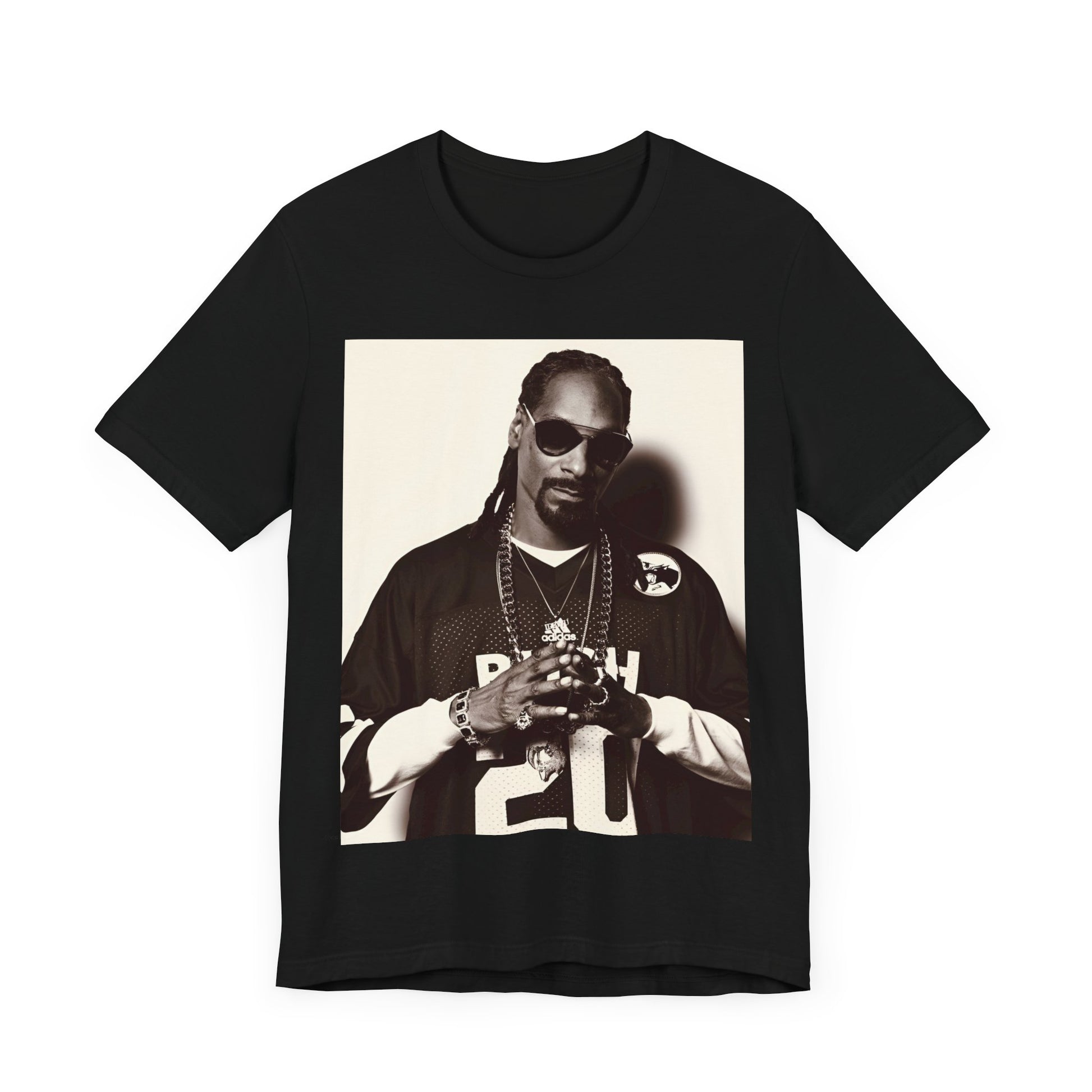 A black graphic t-shirt featuring a black and white, monochrome graphic or photo of Snoop Dogg in an OG style.