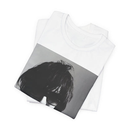 A black graphic t-shirt featuring a graphic related to The Strokes' 'Reptilia' song or era.