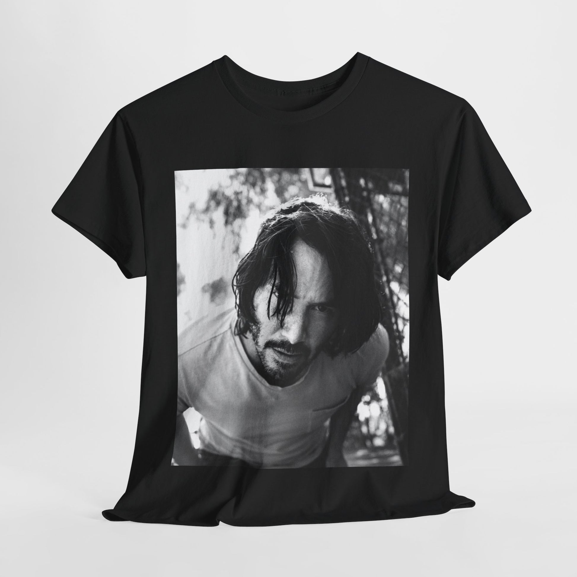 A black graphic t-shirt featuring a graphic of Keanu Reeves with authentic chill vibes.