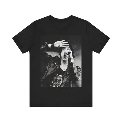A black graphic t-shirt featuring a black and white portrait photo of The Strokes band.