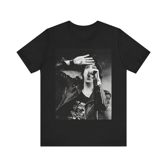 A black graphic t-shirt featuring a black and white portrait photo of The Strokes band.