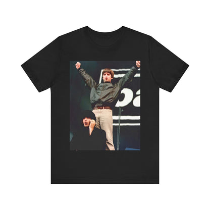 A black graphic t-shirt featuring a graphic or photo of Liam and Noel Gallagher from Oasis performing live on stage.