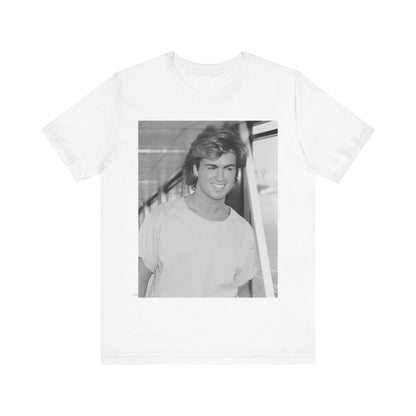 A black graphic t-shirt featuring an 80s black and white vintage photo or graphic of George Michael.