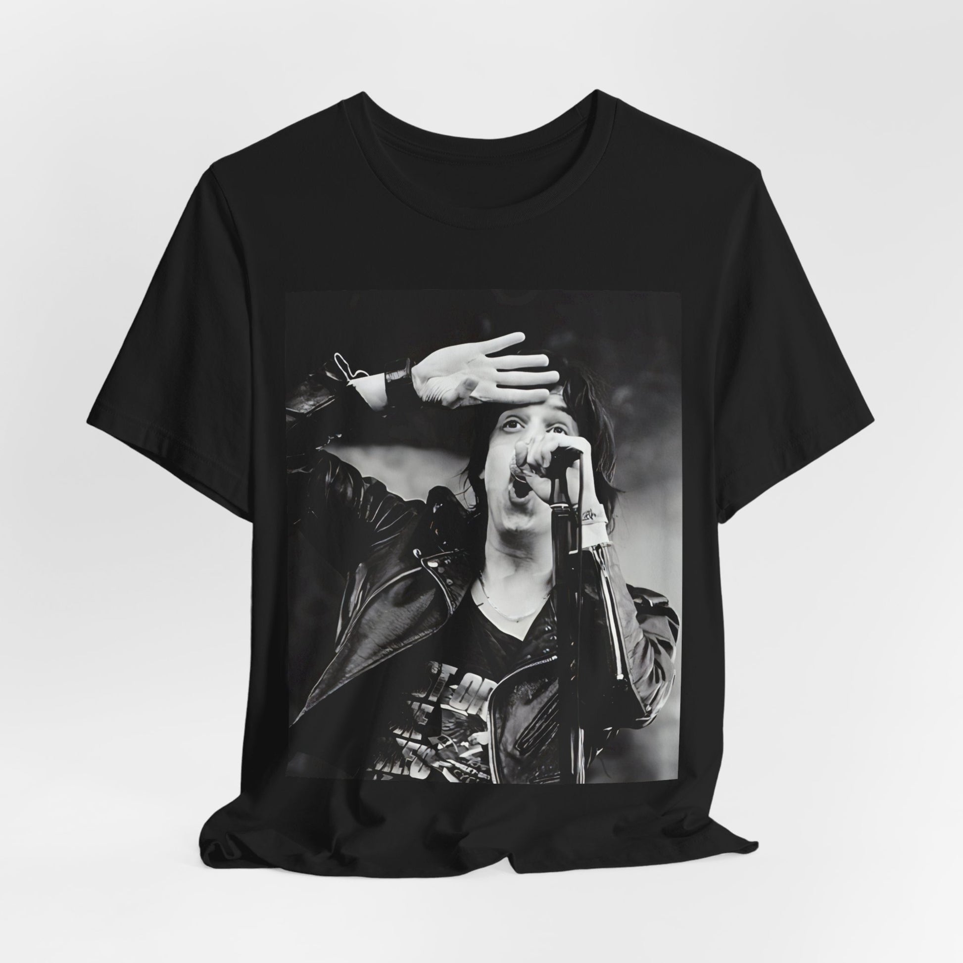 A black graphic t-shirt featuring a black and white portrait photo of The Strokes band.