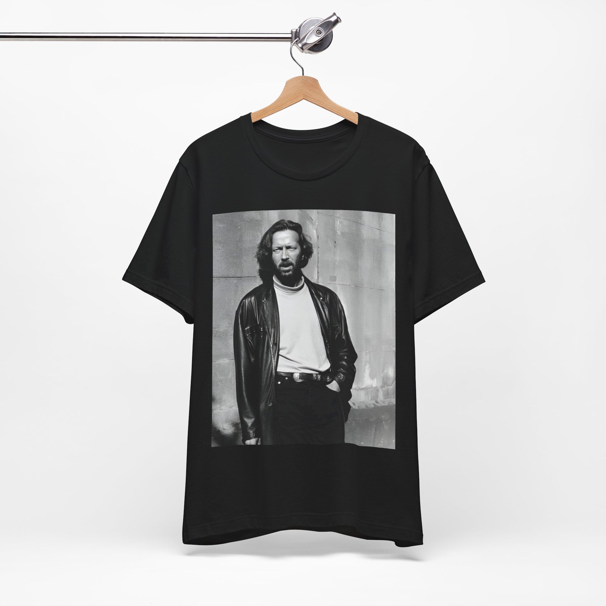 A black graphic t-shirt featuring a retro graphic related to Eric Clapton's 'Cocaine' song or era.