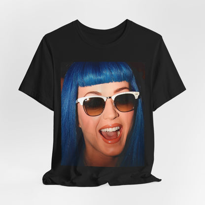 A black graphic t-shirt featuring a retro graphic of Katy Perry with blue hair.