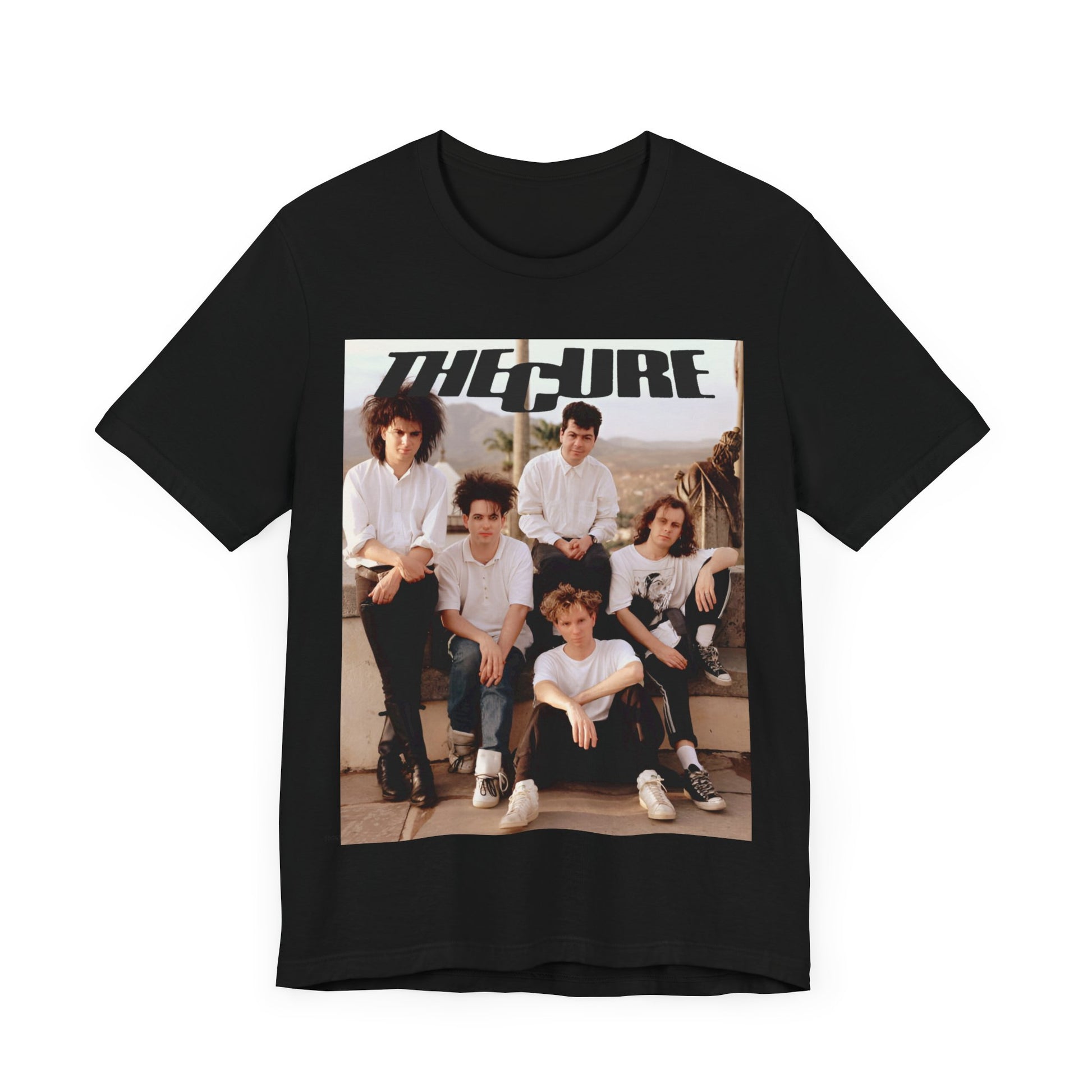 A black graphic t-shirt featuring a vintage graphic of The Cure with a dark romanticism theme.