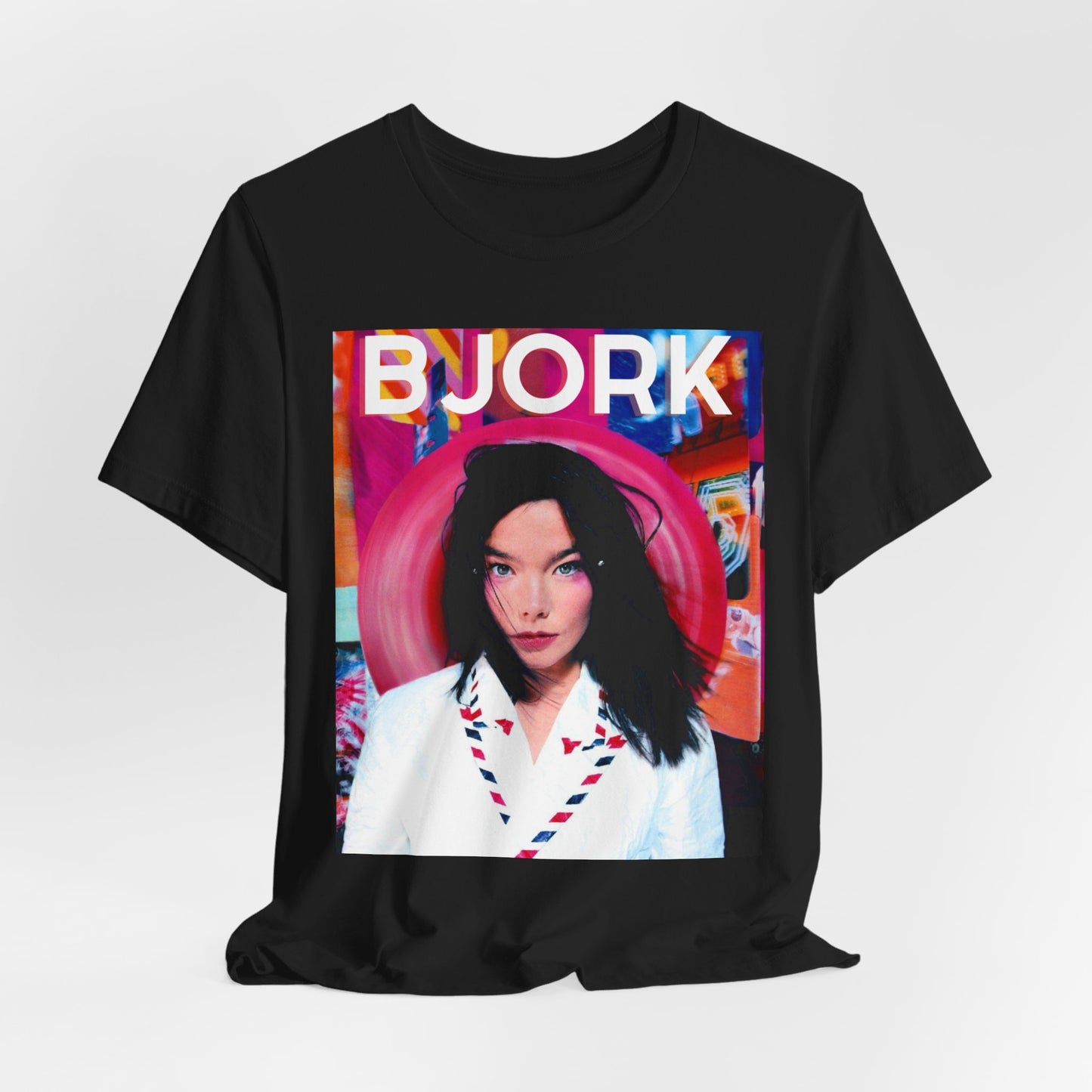 A black graphic t-shirt featuring an artistic or aesthetic pop art graphic of Bjork, with vibrant colors or bold lines.