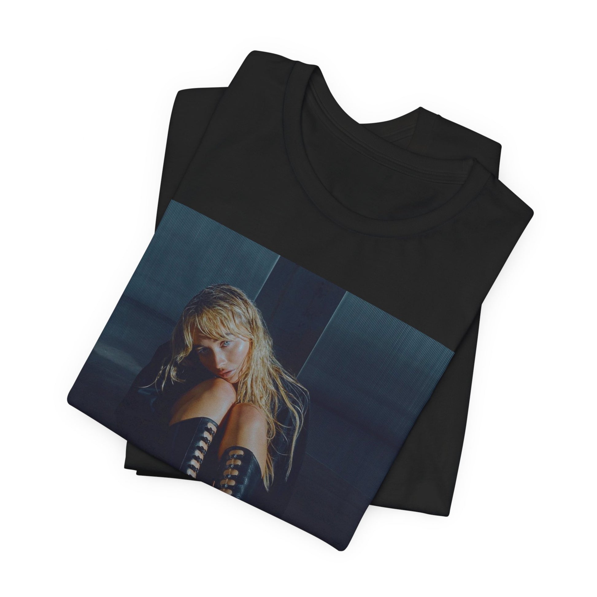 A black graphic t-shirt featuring a bold graphic of Sabrina Carpenter as a pop superstar.