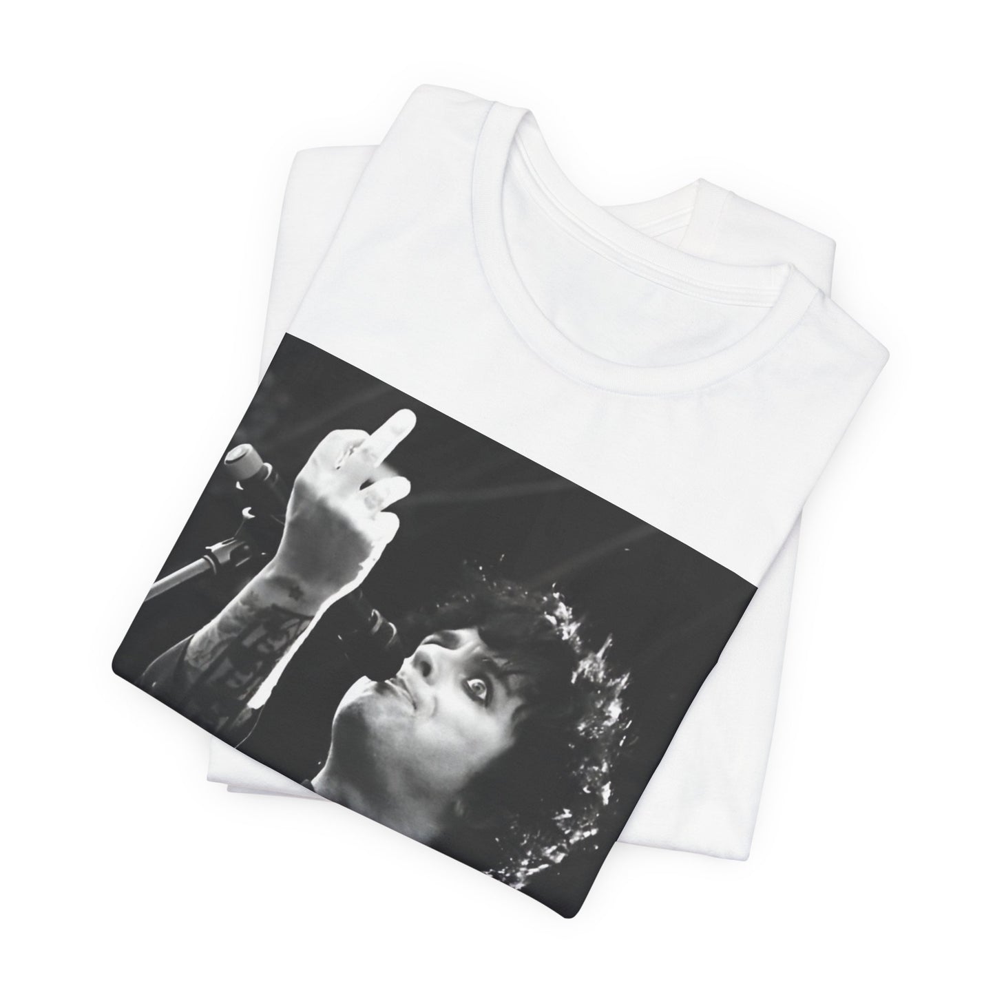 A black graphic t-shirt featuring a graphic of Billie Joe Armstrong from Green Day giving the middle finger during a concert.