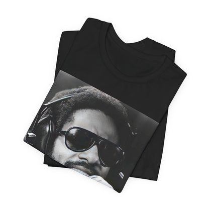A black graphic t-shirt featuring a graphic of Stevie Wonder as a timeless visionary.