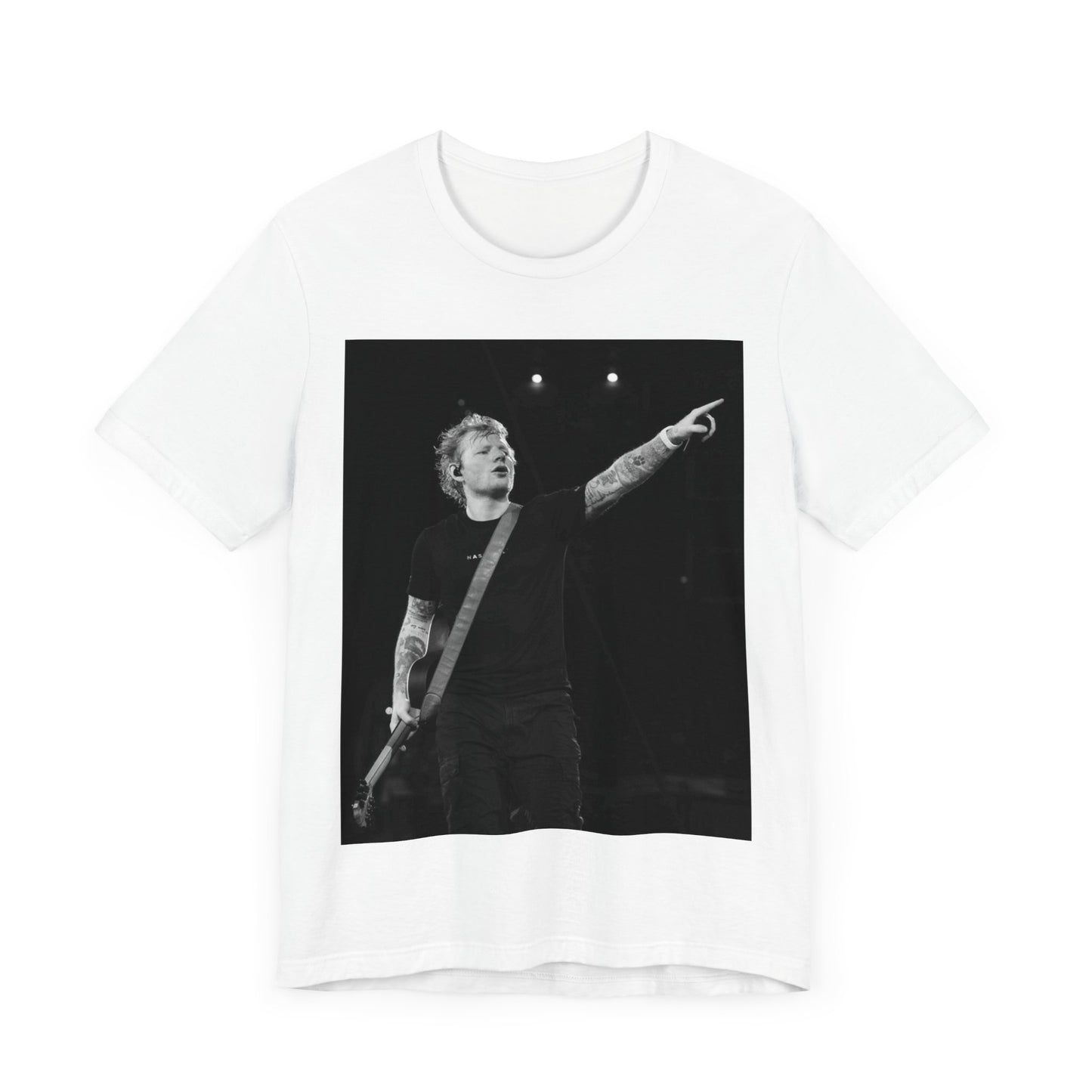 A black graphic t-shirt featuring a black and white graphic or photo of Ed Sheeran performing live on stage.