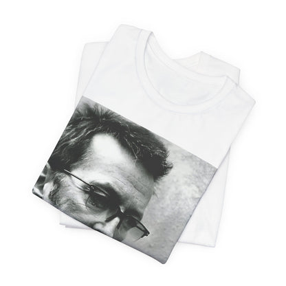 A black graphic t-shirt featuring a black and white, monochrome graphic or photo of Eric Clapton.