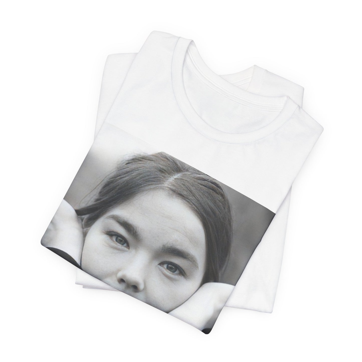 A black graphic t-shirt featuring a black and white portrait photo of Bjork.