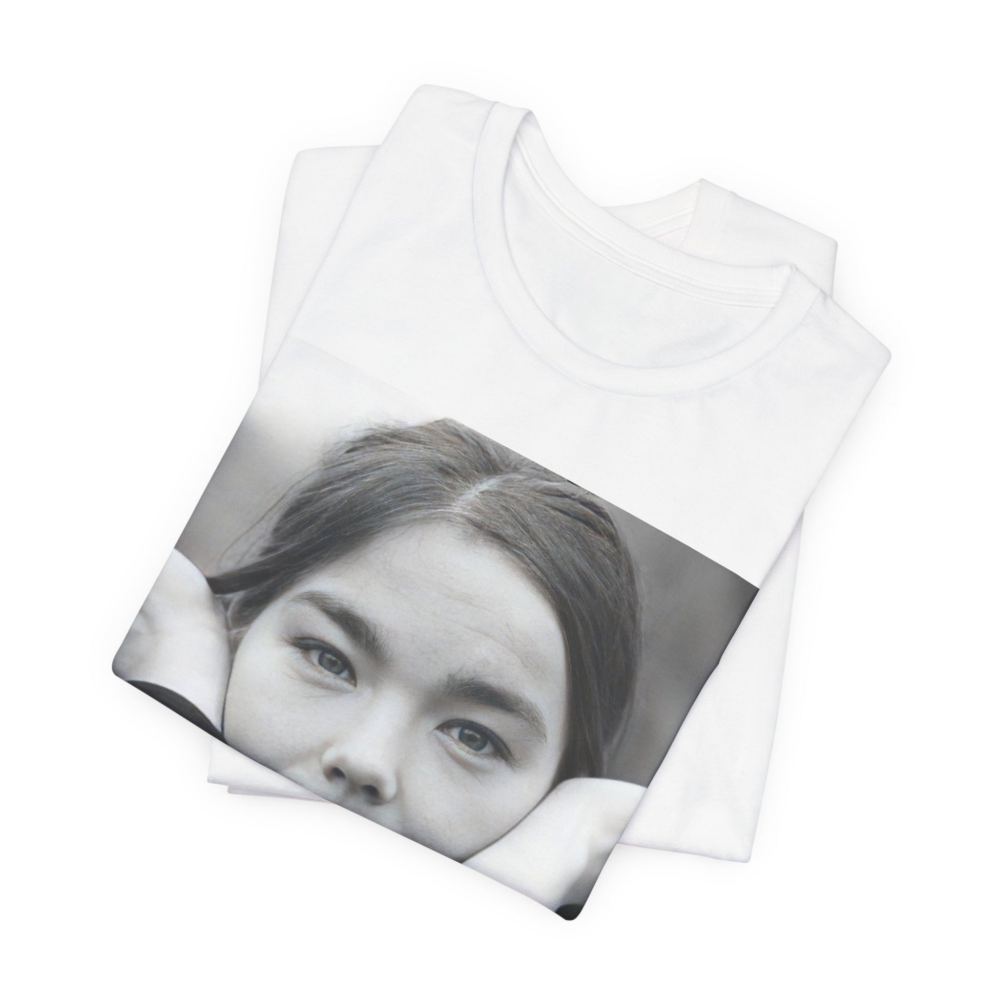 A black graphic t-shirt featuring a black and white portrait photo of Bjork.