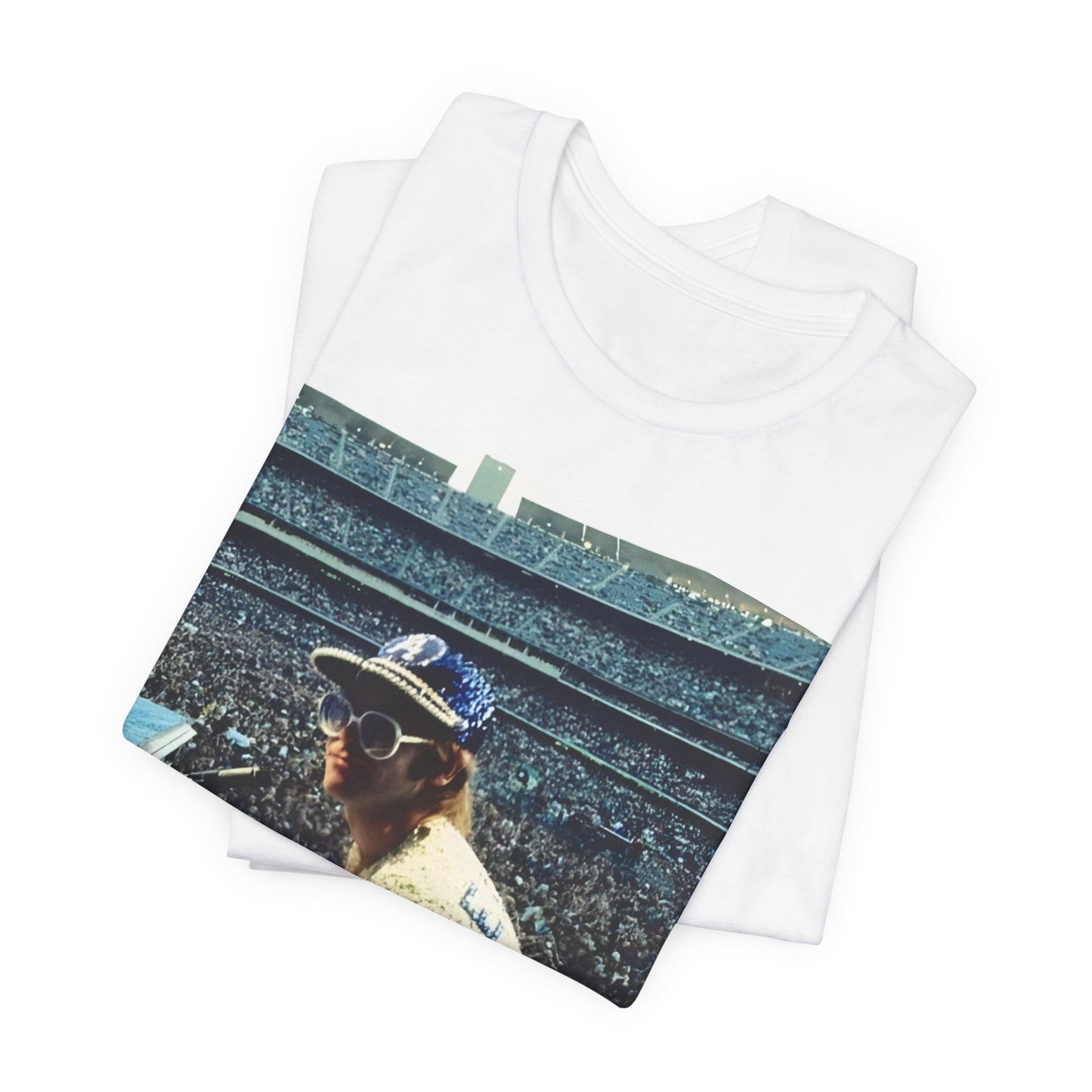A black graphic t-shirt featuring a photo of Elton John from his 1975 Dodgers Stadium concert.