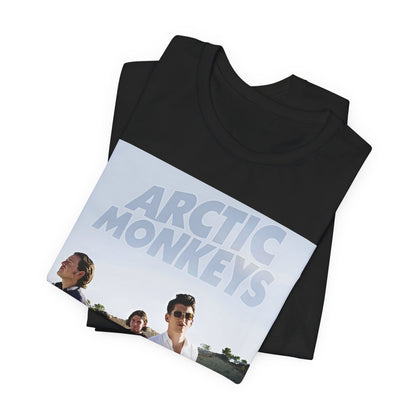 A black graphic t-shirt featuring a design related to Arctic Monkeys' 'AM' album era, possibly with the album art or band imagery.