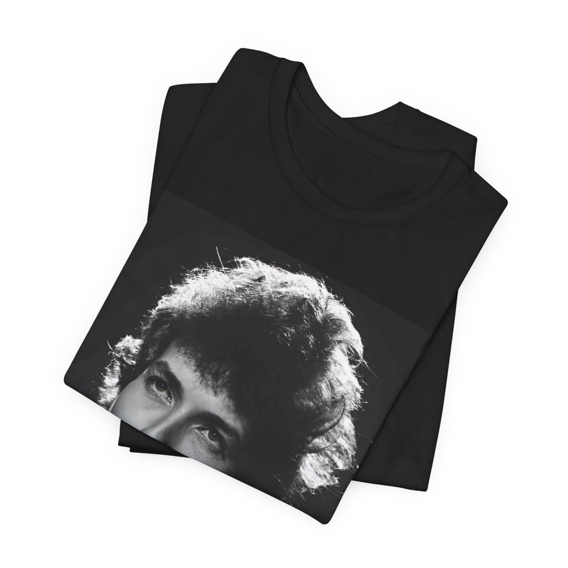 A black graphic t-shirt featuring a graphic of Bob Dylan from the 60s playing his harmonica.