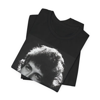 A black graphic t-shirt featuring a graphic of Bob Dylan from the 60s playing his harmonica.