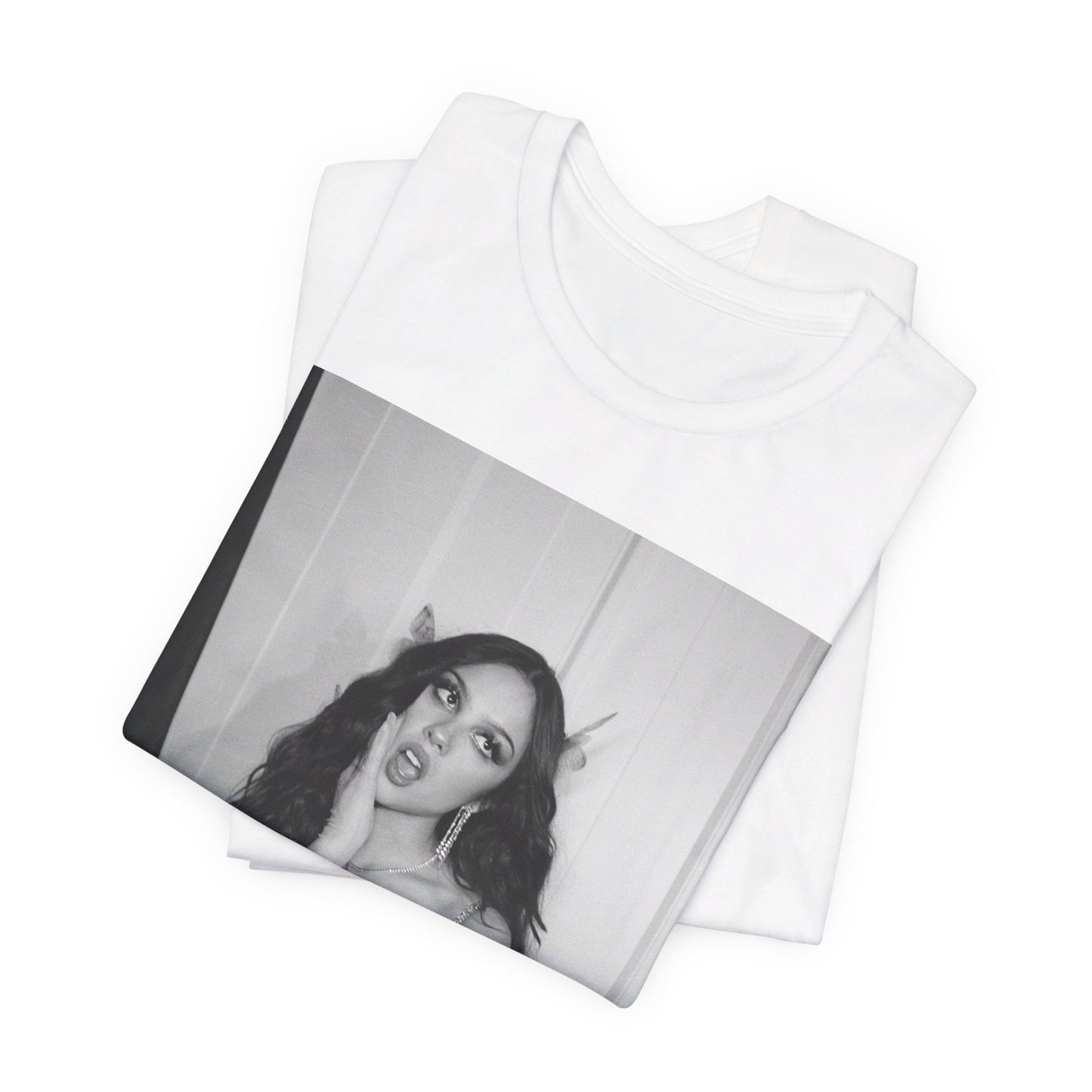 A black graphic t-shirt featuring a black and white, monochrome graphic or photo of Olivia Rodrigo.