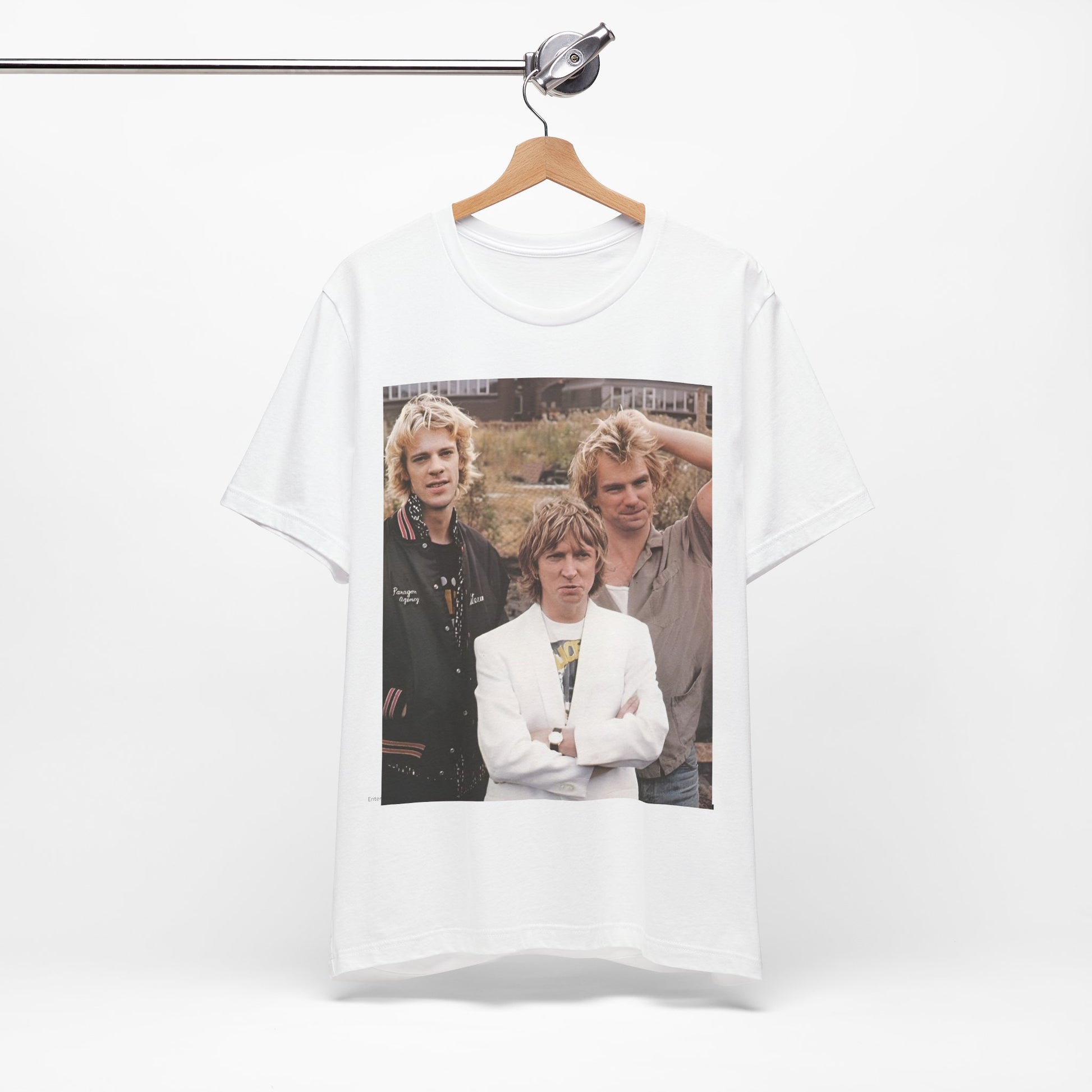 A black graphic t-shirt featuring a graphic of The Police as a timeless three-piece band.
