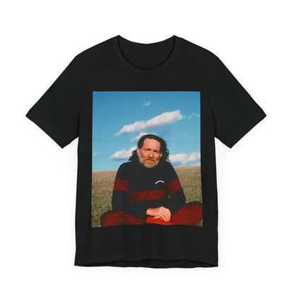 A black graphic t-shirt featuring a classic outlaw country graphic of Willie Nelson.