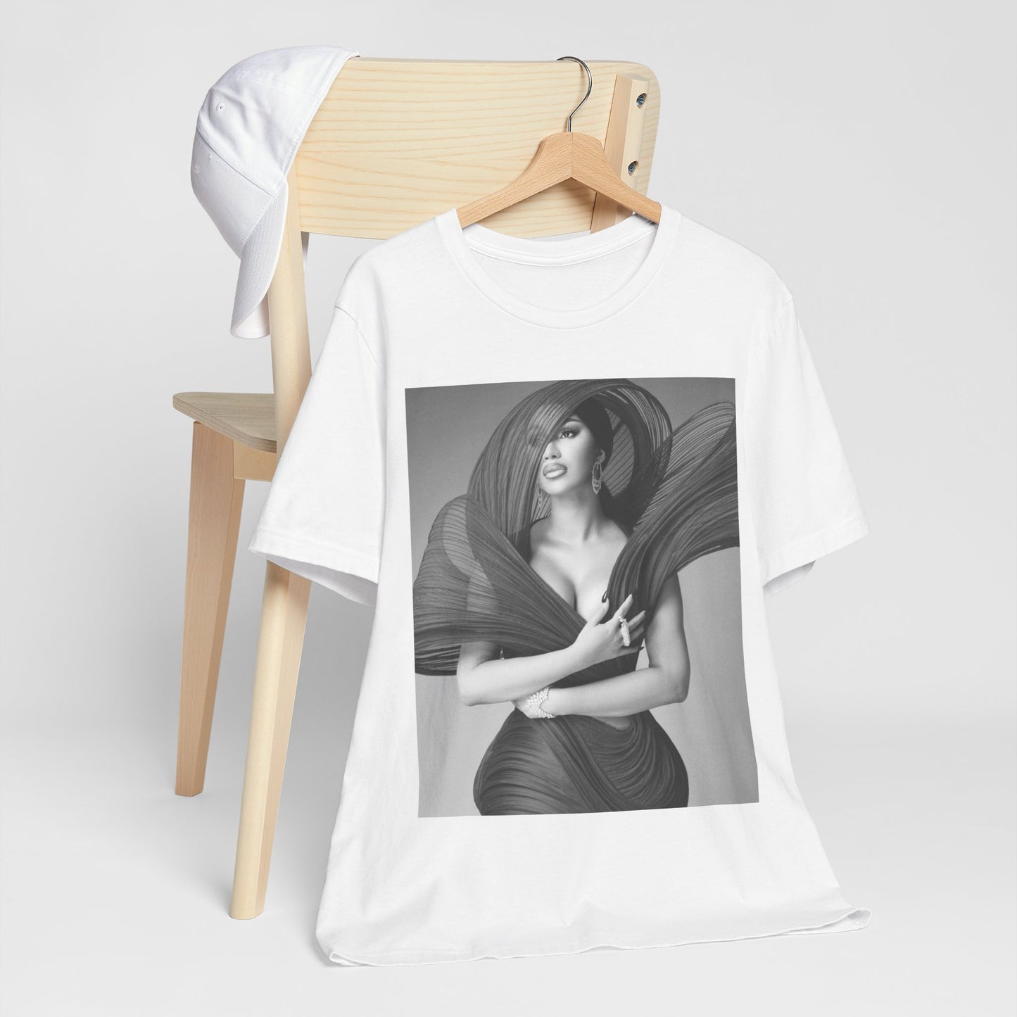 A black graphic t-shirt featuring a black and white graphic of Cardi B, emphasizing her 'Bronx Princess' or rap icon status.