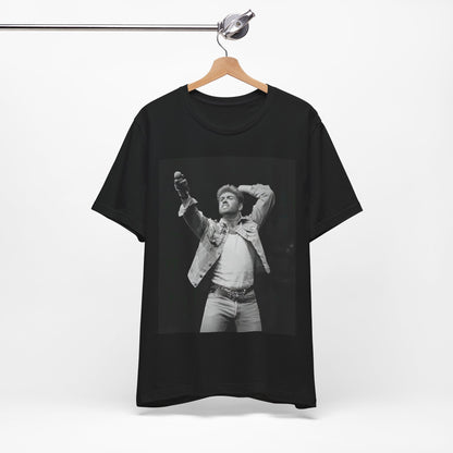 A black graphic t-shirt featuring a graphic or photo of George Michael performing live on stage.