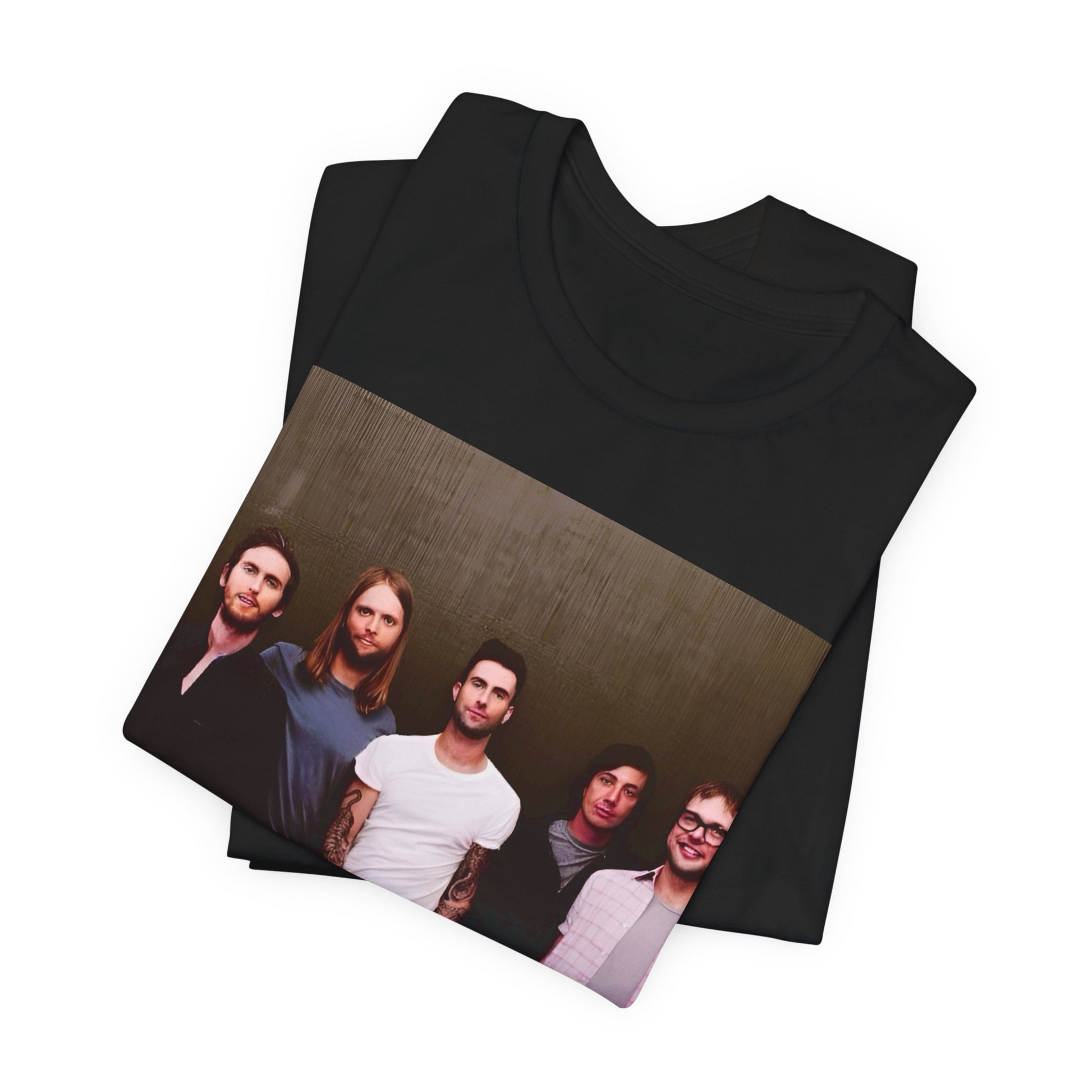 A black cotton Maroon 5 t-shirt featuring a graphic of an artistic, emotional heart design.