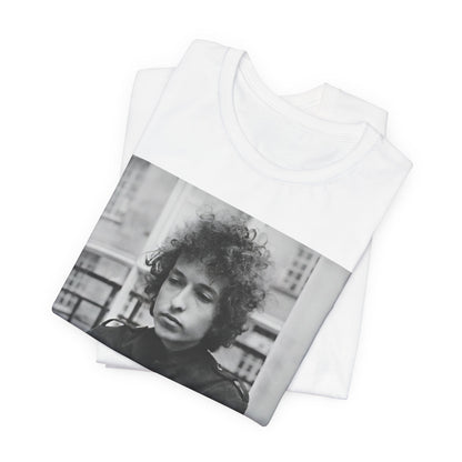 A black graphic t-shirt featuring a black and white graphic of Bob Dylan from the folk revival era.