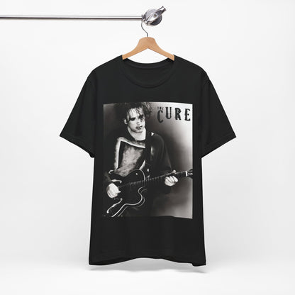 A black graphic t-shirt featuring a vintage goth rock graphic of The Cure.