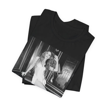 A black graphic t-shirt featuring a retro black and white monochrome graphic or photo of Shakira.